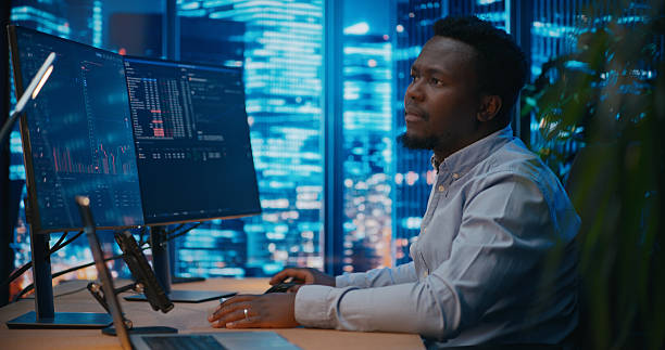 istock Business analyst working with the computer and writing message on the phone 2207359362