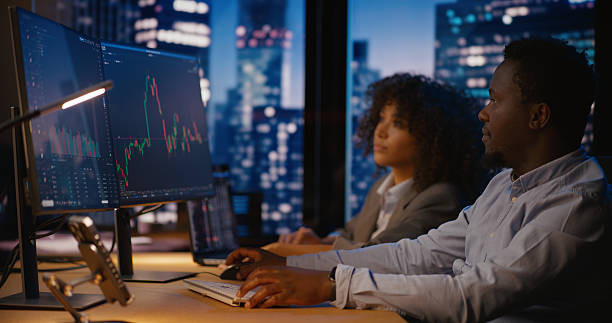 istock Risk analyst professionals work in modern office, analyzing trends and making investment decisions to drive financial success 2207359450