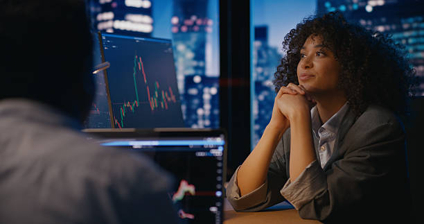 istock Female analyst talks about positive predictions for the company 2207360003