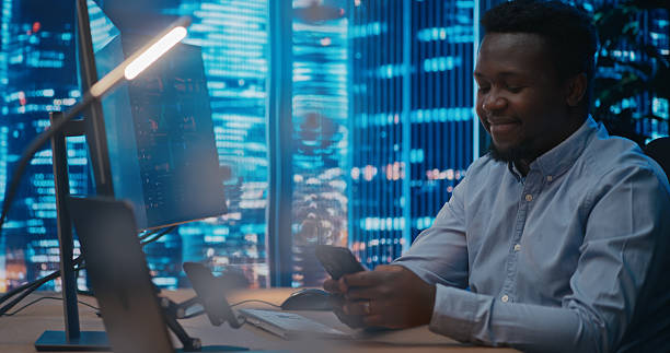 istock Business analyst working with the computer and writing message on the phone 2207360026