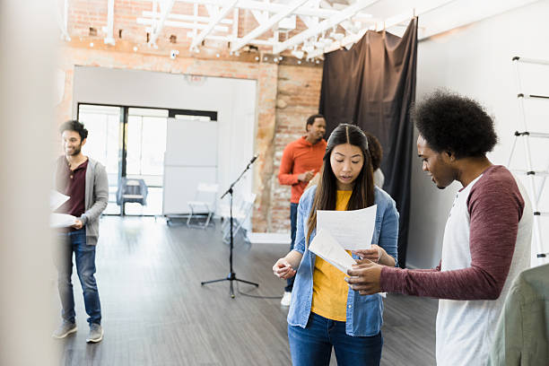 istock Multiracial Group of Actors Rehearsing Lines Together 2207360850
