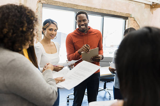 istock Multiracial Team Meeting: Brainstorming Business Strategy 2207360870