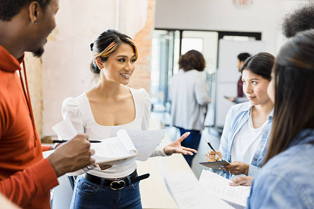 istock Diverse Group of Young Adults Collaborating on Project 2207360881