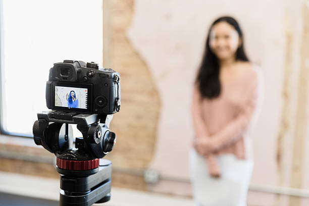 istock Young Woman Vlogger Filming Video Blog Content 2207360896