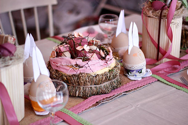 istock Easter pink handmade bunnies decorate the holiday table, Easter table setting 2207361471