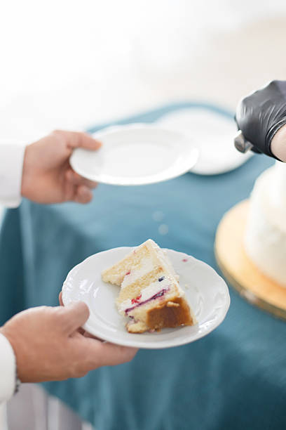 Bride and Groom Cutting a Luxurious Wedding Cake – Sweet Tradition and Celebration