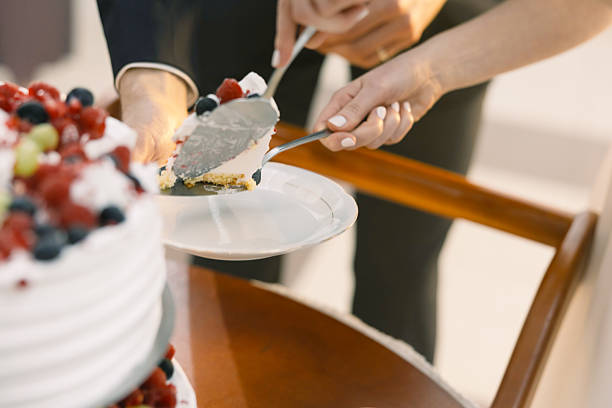 istock Bride and Groom Cutting a Luxurious Wedding Cake – Sweet Tradition and Celebration 2207361613
