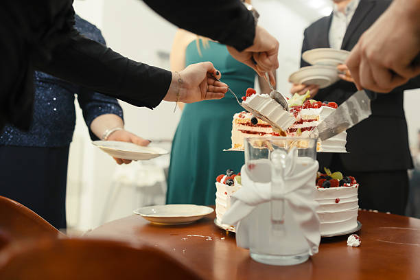 istock Bride and Groom Cutting a Luxurious Wedding Cake – Sweet Tradition and Celebration 2207361666