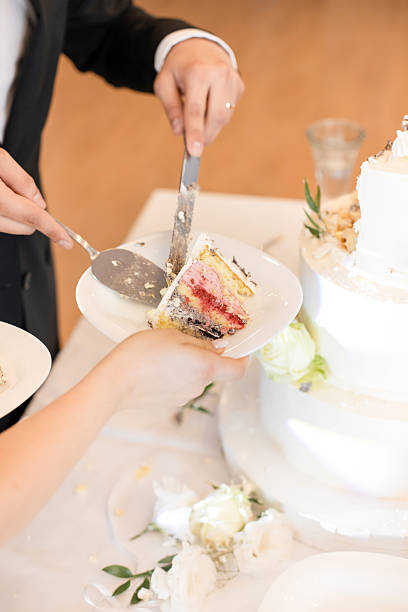 istock Bride and Groom Cutting a Luxurious Wedding Cake – Sweet Tradition and Celebration 2207362228