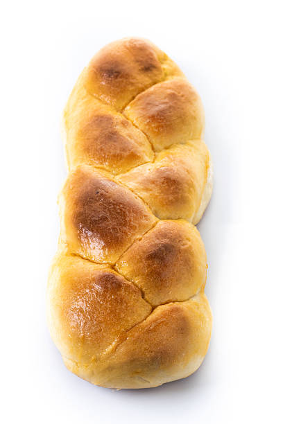istock Traditional Easter braided bread. Tsoureki braid isolated on white background 2207365556