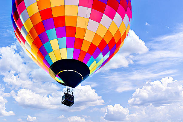 istock Hot air balloon flight over blue sky 2207366803