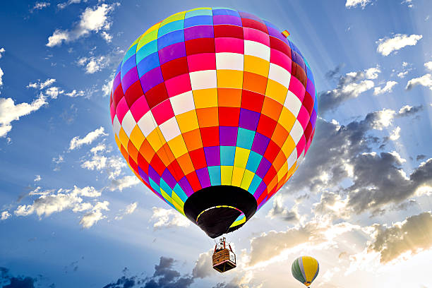 istock Hot air balloon flight over blue sky 2207366944