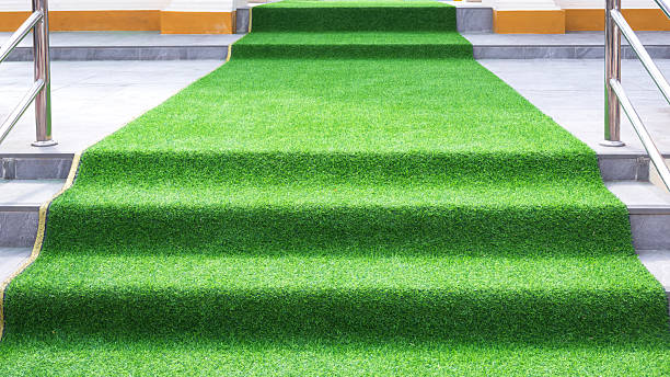 istock Decorative different level walkway with artificial grass mat on stairs and patio for outdoors event 2207367298