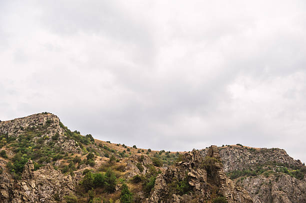 Rugged cliffs with lush green vegetation creating a stunning natural canyon landscape