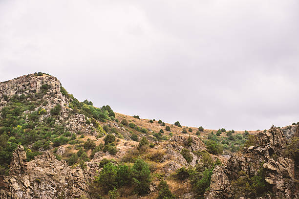 istock Rugged cliffs with lush vegetation creating a stunning natural canyon landscape 2207367484