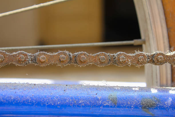 rusty bicycle chain full of corrosion bokeh background