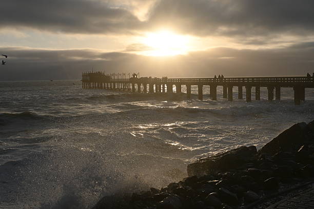 Sunset over Atlantic Ocean at jetty in Swakopmund, Namibia