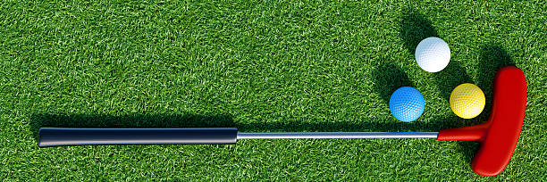 istock Golf putter and balls on green surface 2207369598