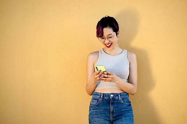 istock Generation Z and millennial girls using a smartphone 2207369931