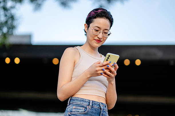 istock Generation Z and millennial girls using a smartphone 2207369984