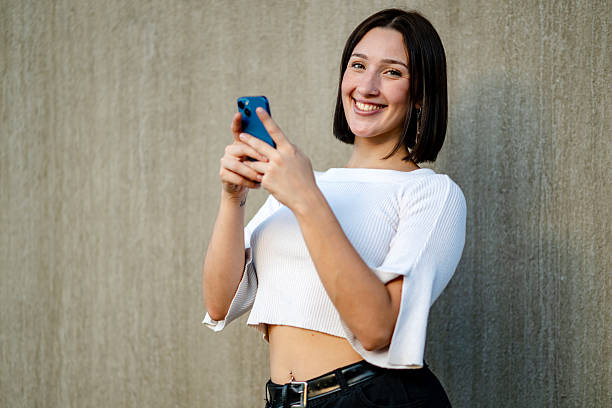 istock Generation Z and millennial girls using a smartphone 2207370005