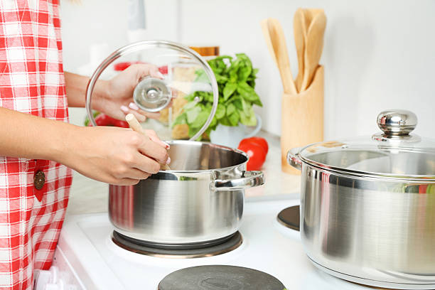 istock Young woman cooking in the kitchen 2207371106