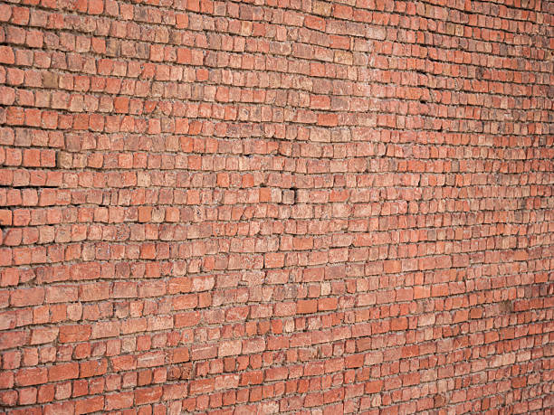 istock Close-up of a weathered brick wall 2207372333