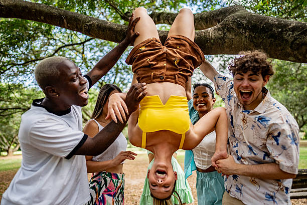 istock Friends playing at public park 2207373896