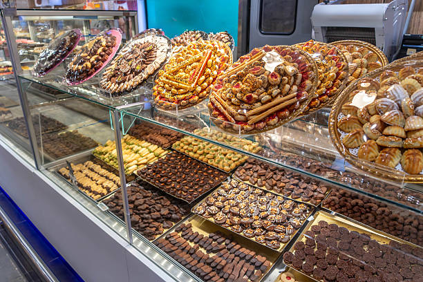 istock A display case with pastries, sweets and cookies, chocolate coated treats, candies, assorted cookies, and baked goods in Saudi Arabia 2207374166
