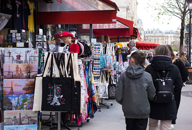 Paris, France: Tourists pass souvenir shops near the Notre Dame Cathedral in  the 4th arrondissement.