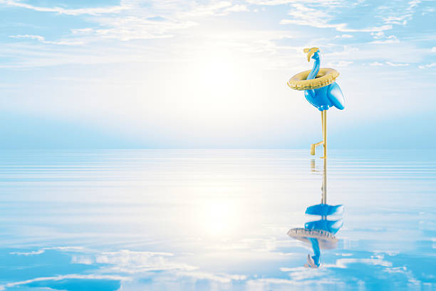 A digitally generated image featuring a flamingo wearing a swim ring on sea, symbolizing relaxation, fun, and the carefree spirit of summer holidays. This playful and vibrant design captures the essence of beach vacations and tropical getaways, making it ideal for travel, leisure, and summertime visuals.
