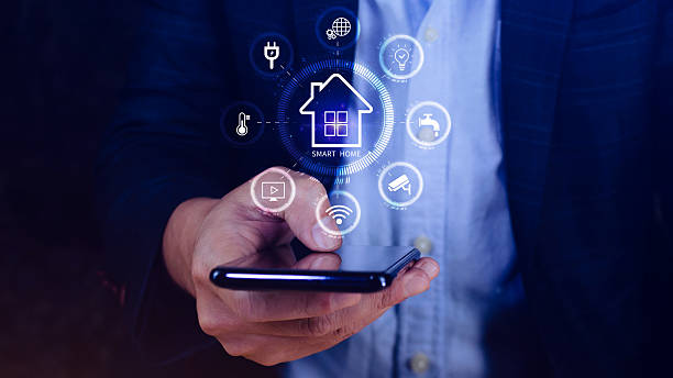 istock Smart home technology, User touches virtual screen on smartphone manage smart home features including security, lighting, temperature, Smart home and Iot concept. 2207382129