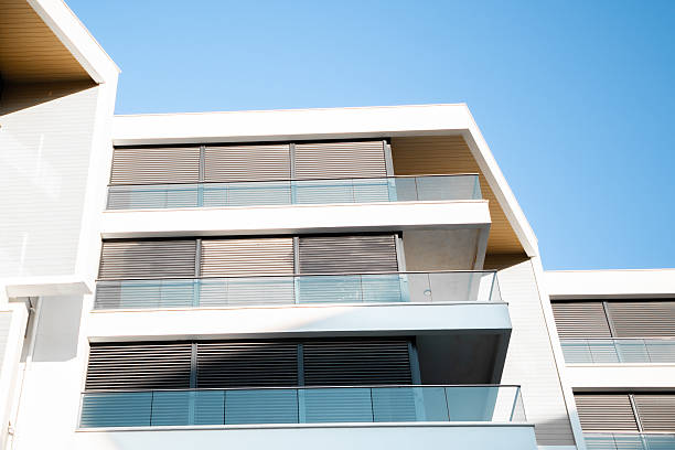 istock Modern Building with White Balconies & Black Metal Shades 2207385222