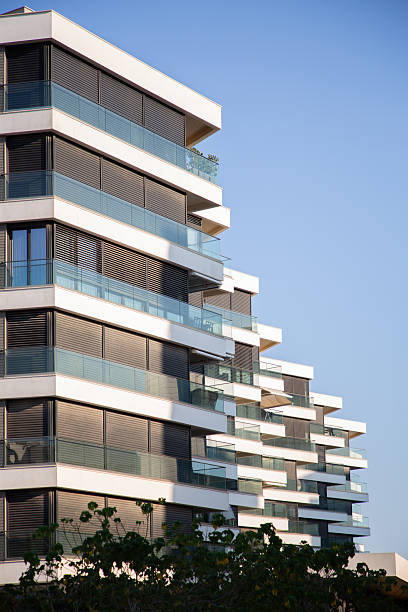 istock Modern Building with White Balconies & Black Metal Shades 2207385260