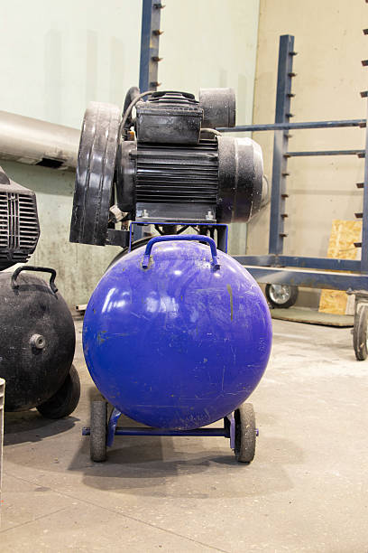 istock The compressor is on the floor in the painter's workshop, the working equipment 2207391787