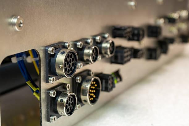 istock Close-up shot of circular wire connectors mounted on a metallic surface. 2207392127