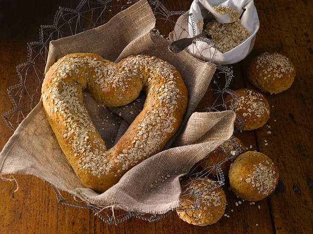 istock Heart-shaped oat bread. Warm tones. 2207392401