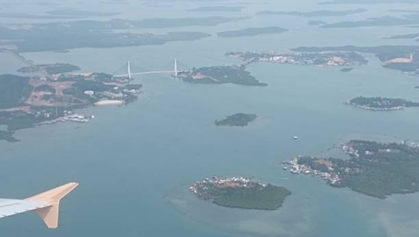 istock Airplane wing with island background 2207392636