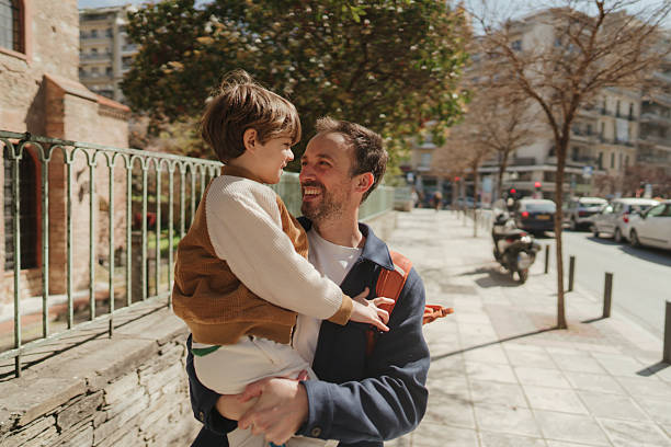 Family with baby talking and walking outdoors