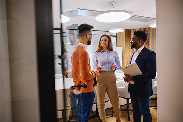 istock Business team discussing work in modern office space 2207394381