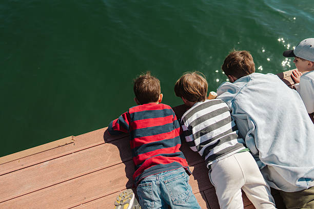 Family enjoying sailing on boat in the open sea