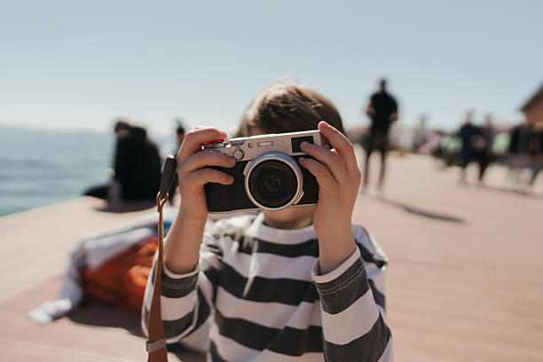 Little photographer on the pier