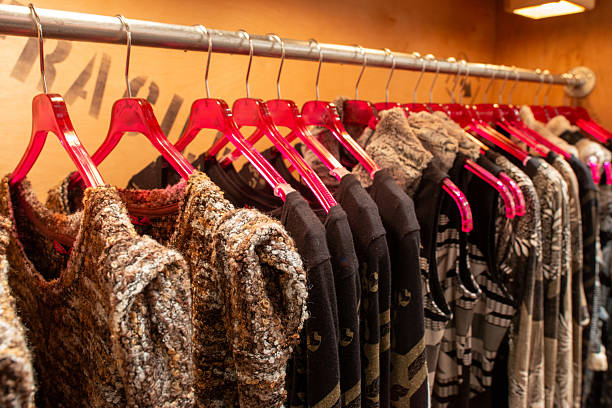 istock fancy designer clothing hanging at a boutique rack 2207398084
