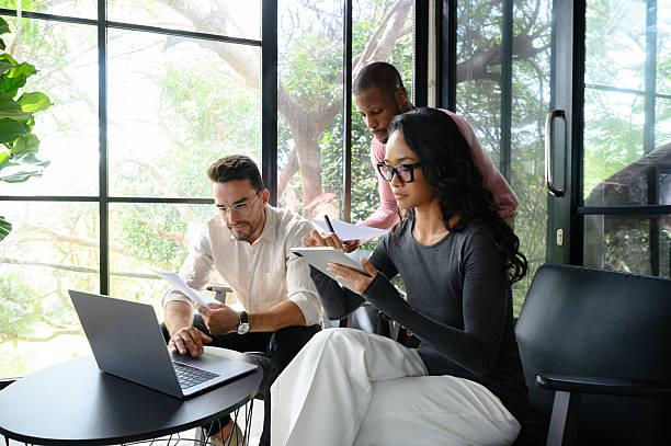 istock Multiracial Professionals Collaborating in Modern Office with Natural Light 2207399122