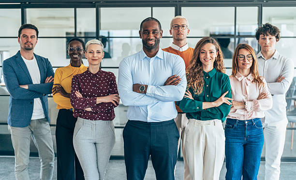 istock Diverse Team of Professionals Standing Together in a Modern Office 2207400968