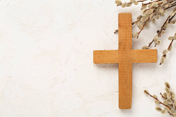 istock Cross with willow branches on concrete background, top, view. Palm Sunday concept 2207401286