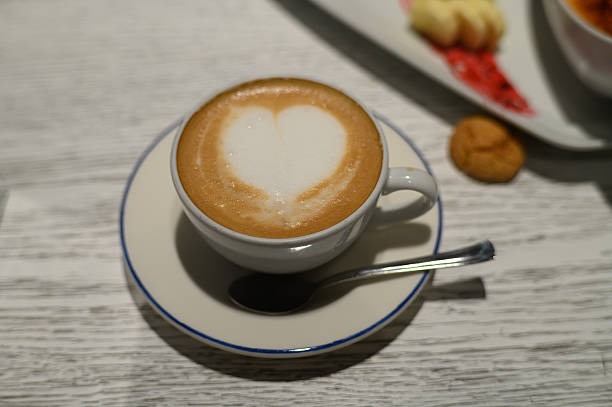 istock Delightful coffee art with a heart shape crafted atop a creamy surface in a cozy cafe setting 2207402218