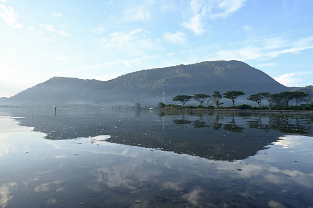 Reflection of coastal and mountain views