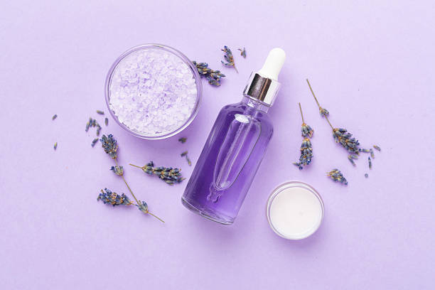 istock Lavender spa cosmetic on color background, top view 2207405964