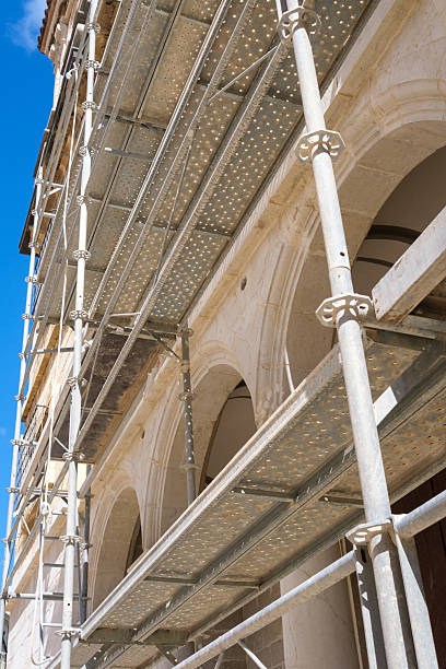 istock Scaffolding supporting historic building renovation under clear blue sky 2207409792